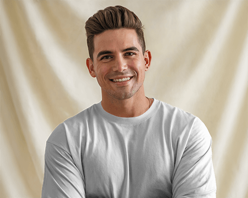 Warm Studio T Shirt Mockup Male Model Smiling Against Soft Beige Draped Background Cozy And Inviting Ambience 0712