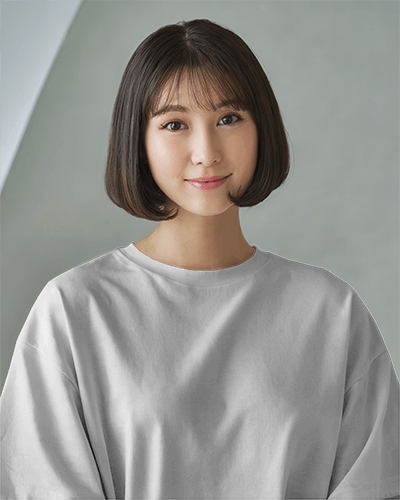 Gentle And Minimal T Shirt Mockup Female Model With Short Bob Soft Smile And Muted Backdrop 0726