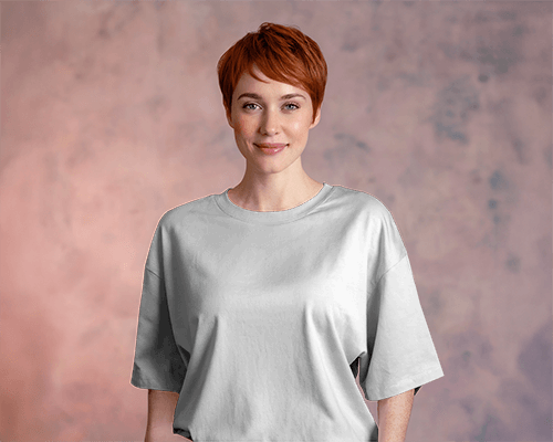 Studio Portrait T Shirt Mockup Female Model Smiling With Short Red Hair Soft Pastel Background Casual And Modern Style 0732