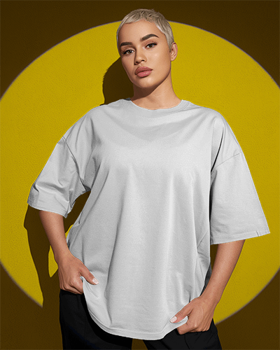 Bold Streetwear T Shirt Mockup Short Haired Female Model In Confident Pose Striking Yellow Backdrop High Fashion Urban Vibe 0744