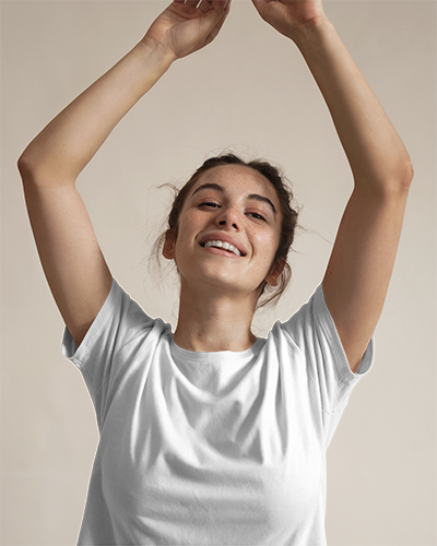 Minimalist Blank Women Round Neck T Shirt Mockup Happy Female Model With Curly Hair Smiling And Raising Arms Neutral Background 0782