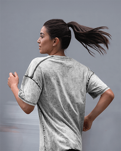 Running Action T Shirt Mockup Female Model In Motion Wearing Acid Wash White Tee With High Ponytail Dynamic And Sporty Feel 0797