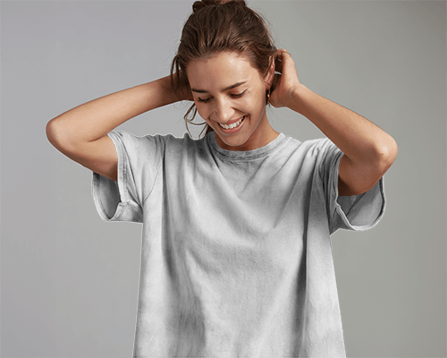 Acid Wash T Shirt Mockup Happy Female Model Smiling And Touching Hair Soft Lighting Casual And Relaxed Aesthetic 0799