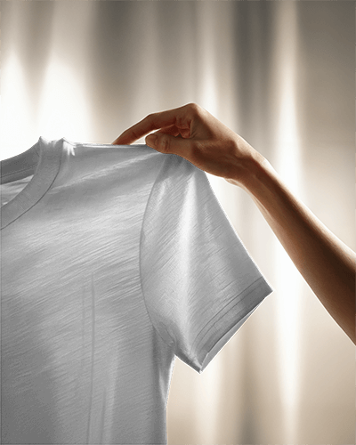Sunlit T Shirt Mockup Hand Holding Fabric Against Soft Golden Lighting Delicate Texture And Premium Quality Focus 0802