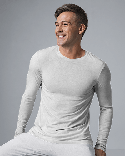 Modern Studio Blank Round Neck Long Sleeve T Shirt Mockup Man In Light Gray Tee Smiling Casual Pose Clean Background 0828