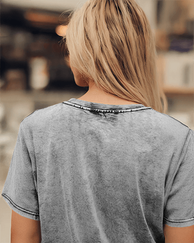 Vintage Acid Wash T Shirt Mockup Women In Distressed Textured Tee Casual Back View Cozy Urban Coffee Shop Ambience 0843