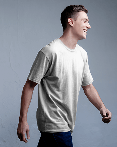 Blank White Round Neck T Shirt Mockup Man Walking Side View Casual Fit Natural Lighting Minimalist Background Modern And Relaxed Look 0849