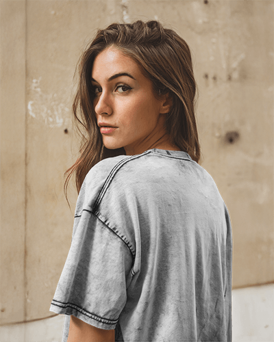 White Acid Wash Back T Shirt Mockup Woman Looking Over Shoulder Urban Background Short Sleeve Casual Streetwear Style Modern And Trendy Look 0852