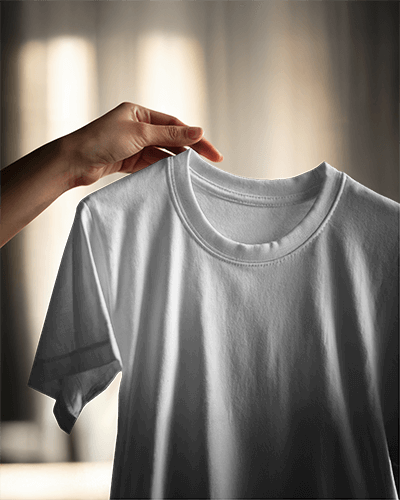 Handheld T Shirt Mockup Soft Draping Fabric Dramatic Lighting Cozy Sunlit Interior Elegant And Minimalist Presentation 0854