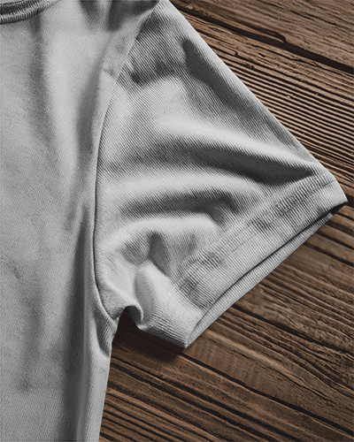 Folded T Shirt Mockup On Rustic Wooden Surface Close Up Of Sleeve Texture And Design Organic And Minimalist Aesthetic 0864