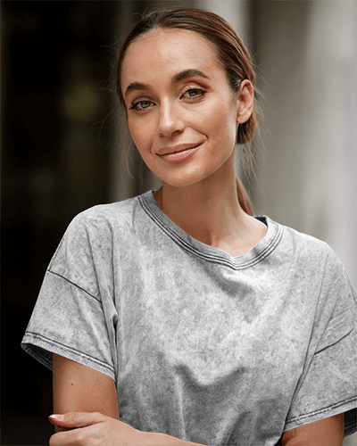 White Acid Wash T Shirt Mockup Smiling Female Model In Natural Lighting Relaxed And Casual Urban Setting 0871