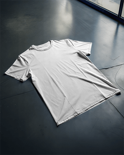 Angled Floor View T Shirt Mockup Minimal Natural Lighting On Modern Concrete Surface Casual And Clean Presentation 0897