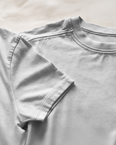 Blank White T Shirt Mockup Close Up Of Chest And Sleeve With Subtle Texture And Soft Lighting 0904