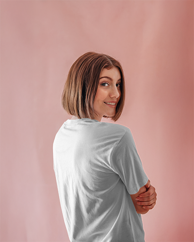 Soft Pink Backview Tshirt Mockup Female Model Smiling Over Shoulder Minimal Pastel Background Light And Cheerful Aesthetic 0927