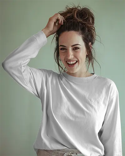Casual Long Sleeve T Shirt Mockup Smiling Female Model Touching Hair Soft Natural Light On Muted Green Backdrop