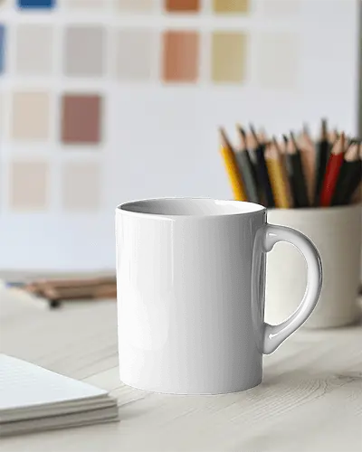 Modern Office Mug Mockup White Coffee Cup With Design Space On Desk Accented By Notebook And Colorful Pencil Holder Clean And Professional Aesthetic  Copy  Ask  Explain