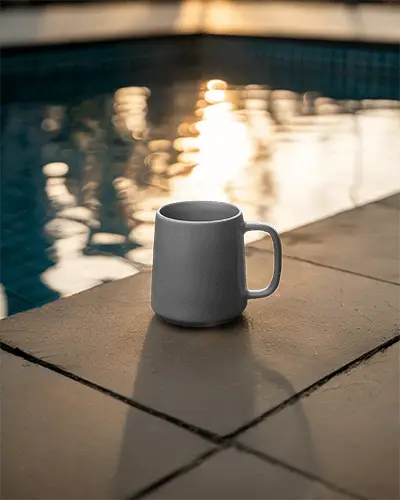 Ceramic Mug Mockup By Poolside With Soft Sunset Reflections And Warm Evening Light 0209
