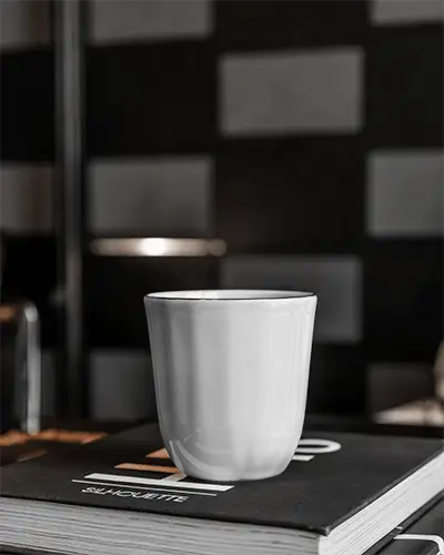 high-quality-ceramic-mug-mockup-on-stack-of-books-ideal-for-coffee-tea-cup-presentation