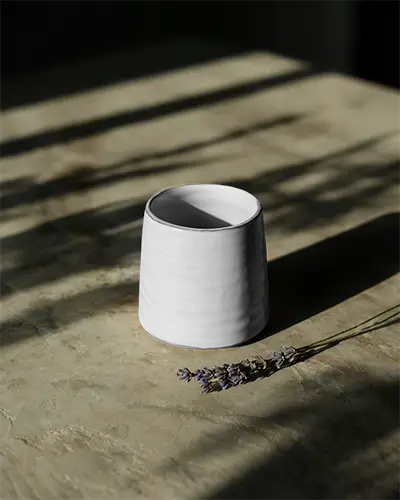 Minimalistic Ceramic Mug Mockup With Flower On Marble Texture Tabletop Shadow Play