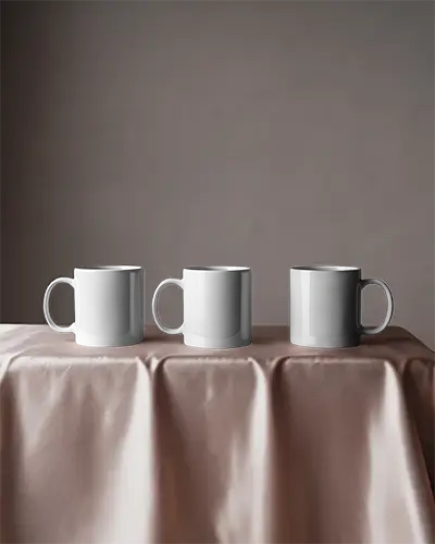 Three Set Ceramic Coffee Mug Mockup On Smooth Tablecloth For Professional Presentation