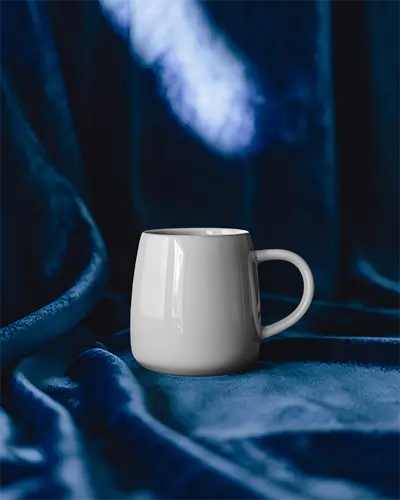 Blank Ceramic Drinkware Mug Mockup On Soft Draped Fabric Background For Customization