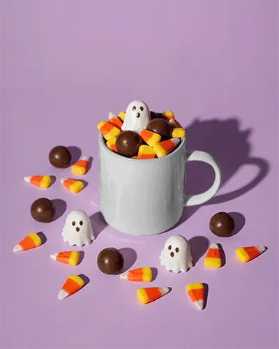 Halloween Candy Mug Mockup With Ghosts Chocolate Balls And Candy Corn Piled High