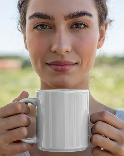 Realistic Mug Mockup Template In Hand For Branding And Promotional Use