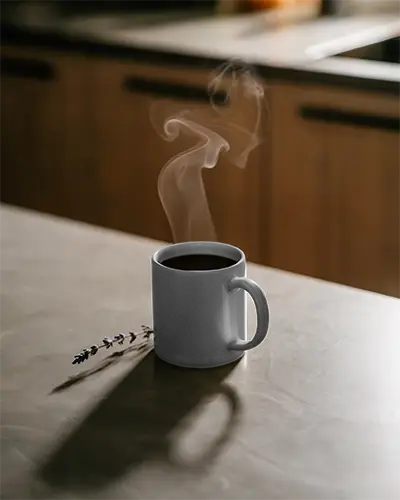 Classic Steaming Coffee Mug Mockup On Minimalist Kitchen Counter For Beverage Branding