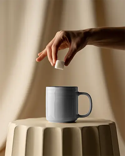 Ceramic Mug Mockup With Hand Adding Sugar Perfect For Beverage Brand Promotion