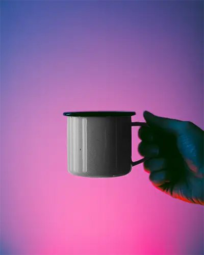 Ceramic Mug Mockup Display In Hand Isolated On Colorful Gradient Studio Background