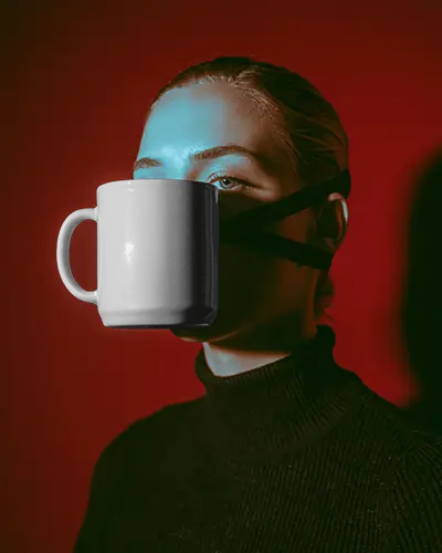 Surreal Mug Mockup On Face With Moody Red And Teal Studio Lighting