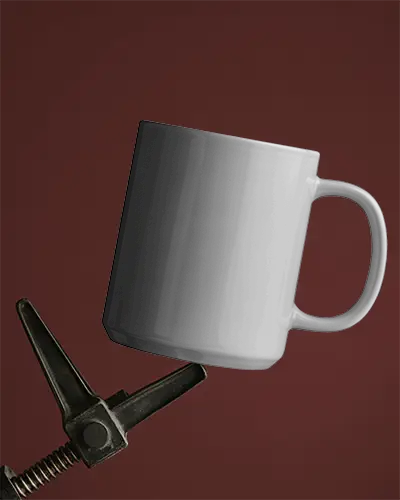 Sleek Ceramic Mug Mockup Gripped By Industrial Clamp On Deep Red Backdrop Clean Visual