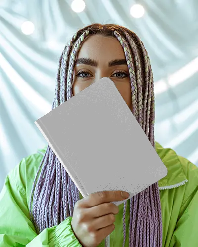 Trendy Notebook Mockup Held By Model With Purple Braids And Soft Studio Lights