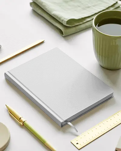 Fresh Desk Notebook Mockup With Soft Green Tones And Simple Stationery