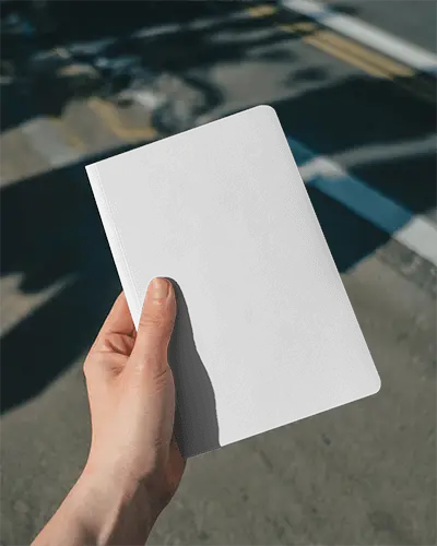 Hand Holding Clean Minimalist Notebook Mockup For Personalized Design Template Use