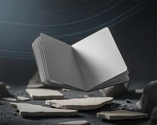 Open Notebook Mockup Floating Above Rough Stone Textured Ground Background