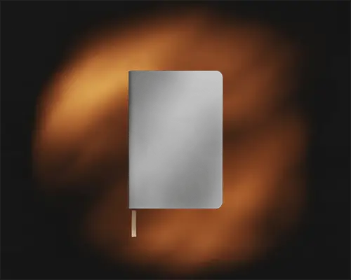 Realistic Notebook Mockup Showcasing Blank Leather Cover With Soft Focus Background