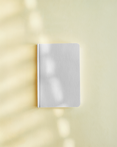 notebook-mockup-top-view-hardcover-white-notebook-on-soft-yellow-background-with-dappled-sunlight-shadows-warm-and-inviting-aesthetic-027