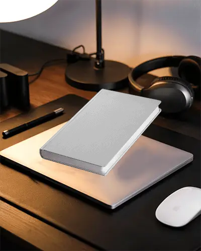professional-desk-setup-with-closed-notebook-mockup-with-laptop-wireless-mouse-and-headphones