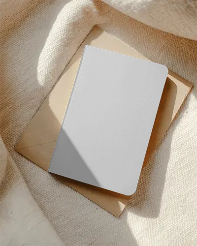 Sleek Minimalist Hardcover Notebook Mockup On Textured Fabric Background For Modern Designs