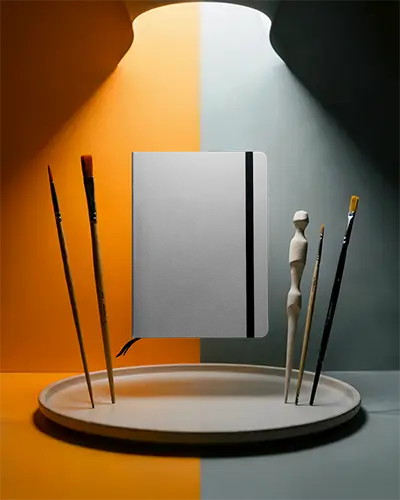 Modern Minimalist Notebook Mockup With Floating Design And Brushes For Creative Projects