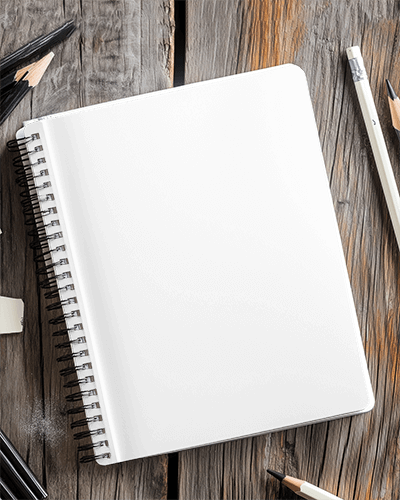 Rustic Wooden Desk Notebook Mockup Surrounded By Pencils And Sketching Tools Creative Workspace