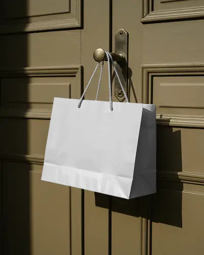 Eco Friendly Paper Bag Mockup With Rope Handles Hanging On Textured Door For Branding