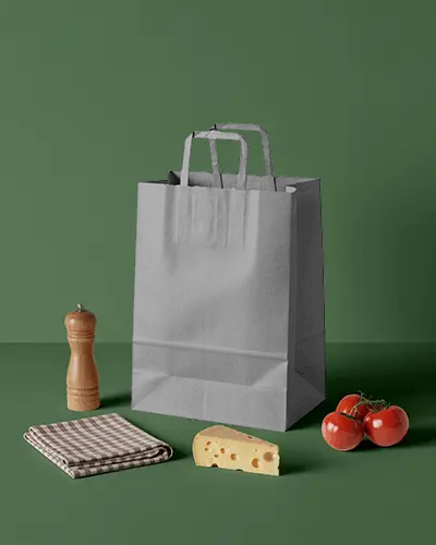 Eco Friendly Paper Bag Mockup With Tall Handle Standing On Solid Background