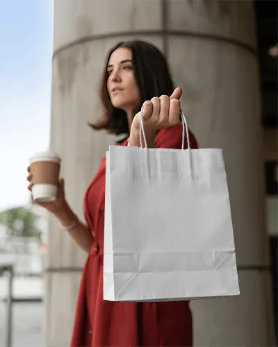 Blank Paper Bag Mockup Held By Female Model For Brand Marketing Purposes