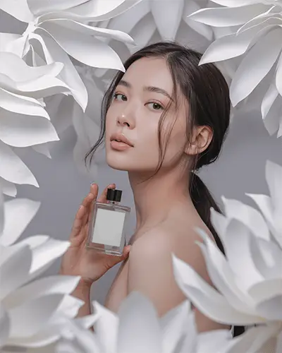 Floral Elegance Perfume Mockup Minimalist Female Model Surrounded By White Petals