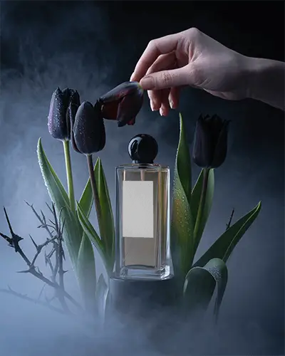 Mysterious Perfume Mockup Hand Touching Surrounded By Black Tulips And Fog