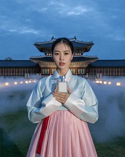 Halloween Perfume Mockup Woman In Traditional Hanbok Holding Bottle In Misty Palace Yard