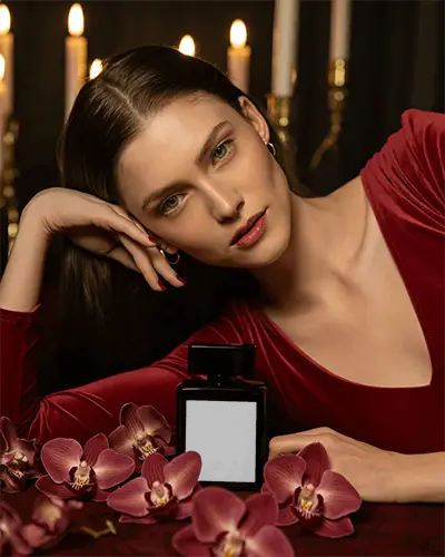 Artistic Perfume Mockup Elegant Woman In Red Dress With Orchids And Candlelight Glow
