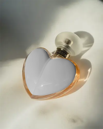 Premium Glass Heart Perfume Bottle Bottle With Unique Cap Fragrance Mockup For Brand Presentation